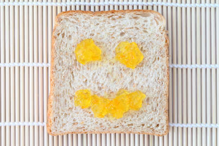 Bread with jam smile  の写真素材