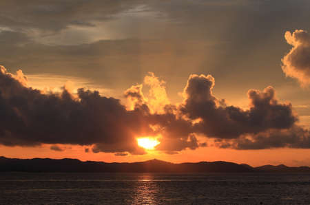 Beautiful tropical sunset on the beach in Phuket の写真素材
