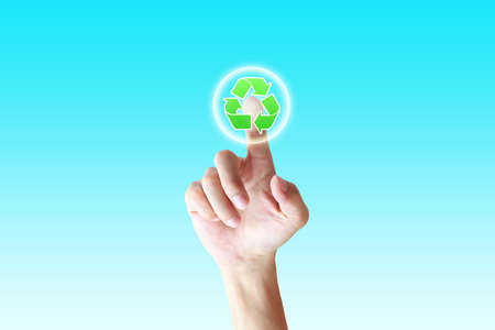 hand pushing a button recycle on a touch screen interface