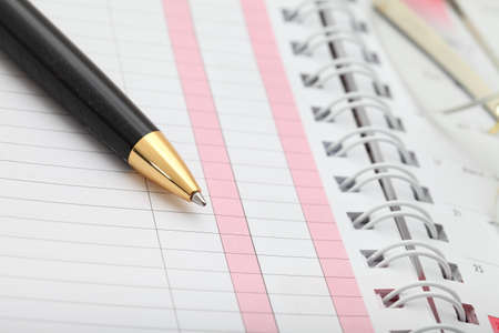 vintage notebook paper and pensの写真素材