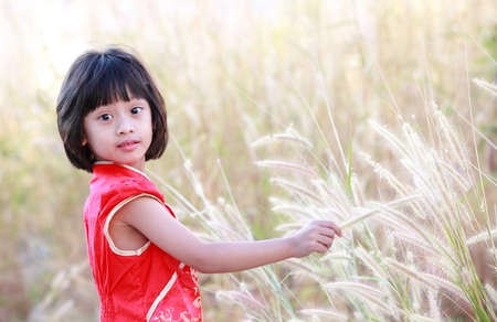 Chinese girl play in the park,Portrait of little Asian girl の写真素材