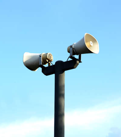 loudspeakers on blue skyの写真素材