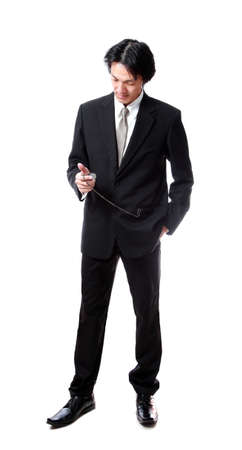 Businessman looking a pocket watch,attractive asian man の写真素材