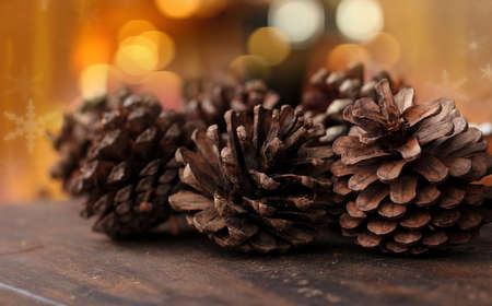 Pine cones on christmas backgroundの写真素材