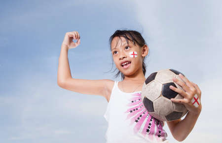 Young Girl Play Foot Ballの素材