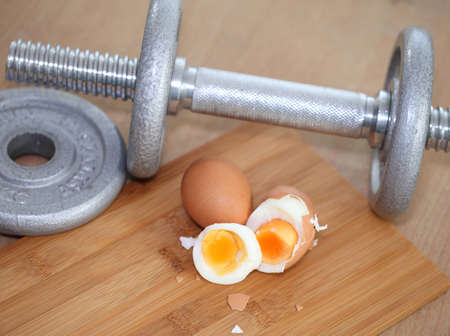 Eggs protein diets and dumbbells の写真素材