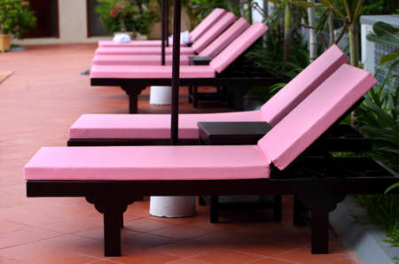 Modern colorful daybed at swimming poolの写真素材