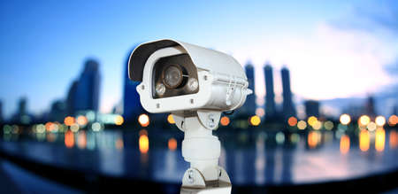 CCTV with Blurring City in night background.の写真素材