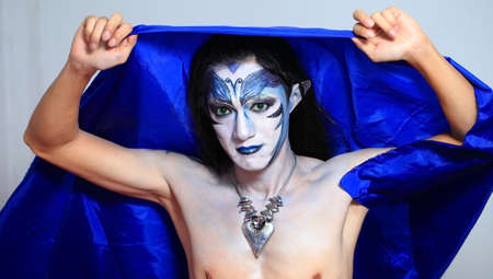 Beautiful man with abstract make up.の写真素材