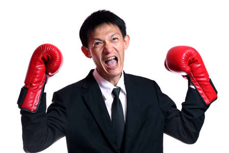 Boxing gloves man - concept showing aggressive female  flexing muscles wearing boxing gloves...