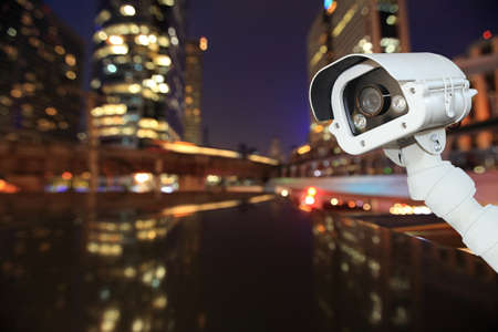CCTV with bokeh blurring city in night background.
