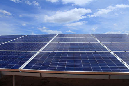 Solar energy panels in grass against sunny sky.Solar panels in the power plant for renewable energyの写真素材