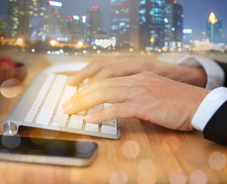 Businessman typing on keyboard at workplace Man working in home office hand keyboard.の写真素材