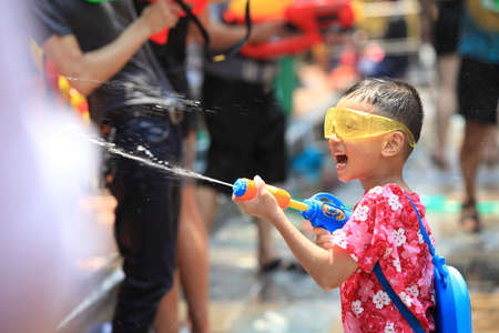 Bangkok, Thailand - April 13: Tourists shooting water guns and having fun at Songkran festival, the traditional Thai New Year, on Khao San Road in Bangkok, Thailand.のeditorial素材