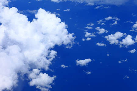 white fluffy clouds in the blue sky.The blue sky and beautiful white clouds.