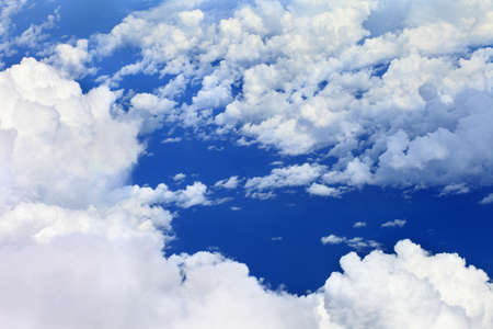 white fluffy clouds in the blue sky.The blue sky and beautiful white clouds.の写真素材