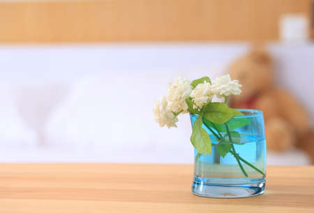 Beautiful jasmine flower in the pot on the bedroom.の写真素材