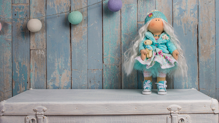 tilde doll on a blue background of the boards with .の写真素材