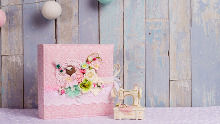 a photo album in the style of shabby chic on a blue backgroundの写真素材