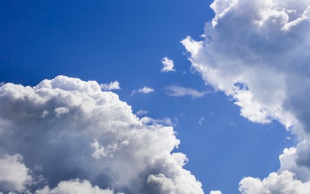a big and fluffy cumulonimbus cloud in the blue sky.の写真素材