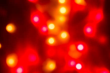 Red and yellow holiday bokeh. Abstract Christmas backgroundの写真素材