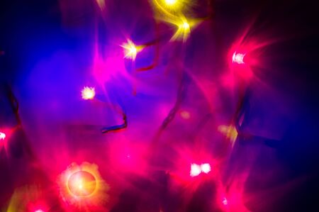 Red and yellow holiday bokeh. Abstract Christmas backgroundの写真素材