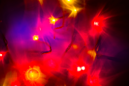 Red and yellow holiday bokeh. Abstract Christmas background.の写真素材