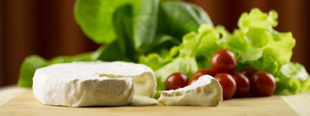 Camembert with salad and cherryの写真素材