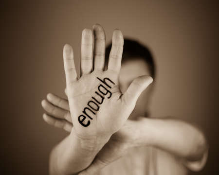 sign enougn on the man's handの写真素材