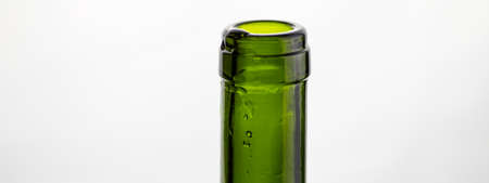 Bottleneck of green glass on white background