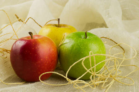 three apples red yellow and green