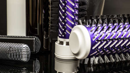 hair straightener on black backgroundの写真素材