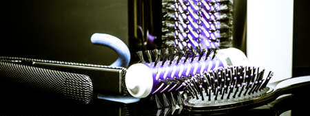 hair straightener on black backgroundの写真素材