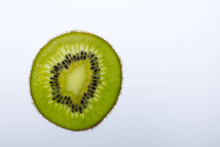 kiwi slice on white backgroundの写真素材