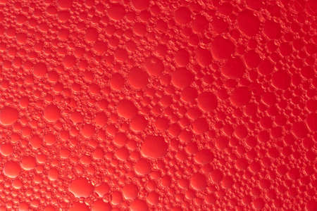 red background with soap bubblesの写真素材