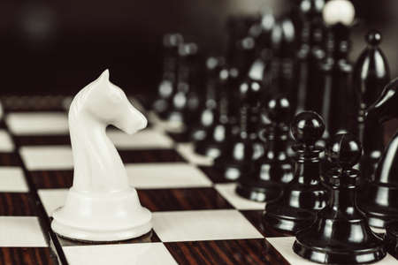 Single chess piece against many enemies