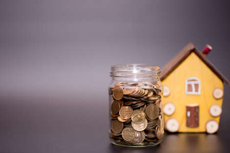 a scattering of coins on a black backgroundの写真素材
