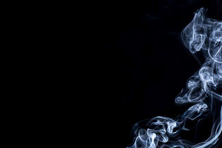 White smoke on black backgroundの写真素材