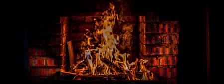 the fire in the brick fireplace