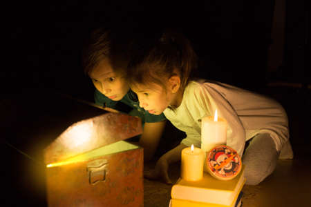 Childhood dreams. Cute girl and adventurous boy found a treasures. Happy young pirates.の写真素材