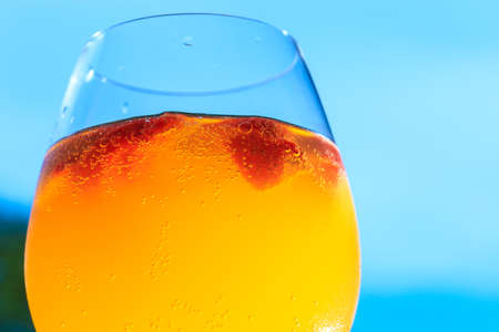 Traditional summer drink sangria. Refreshing drink with orange and strawberry.の写真素材