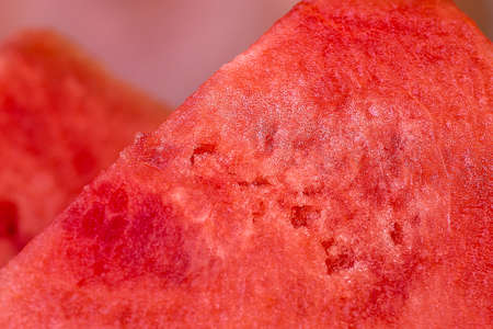 Slice of fresh and juicy red watermelon close upの写真素材