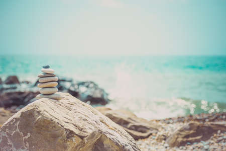 Stack of zen stones near sea. Harmony, balance.の写真素材