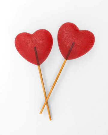 Red heart lollipops isolated on white background 3d. Valentine's concept with Two sweethearts, always together.の写真素材