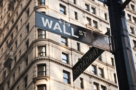 Street sign at the corner between Wall Street and Broadway  New York City の写真素材