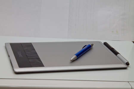 shows a computer tablet with pen