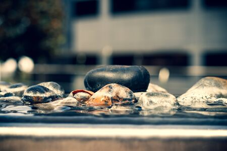 Closeup of stone on a warter fountainの写真素材