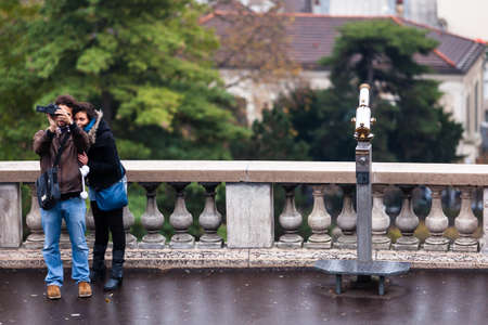 PARIS, FRANCE - NOVEMBER 29, 2013: Tourists in Montmartre. Monmartre area is popular among tourists in Paris, the most visited city worldwide.のeditorial素材