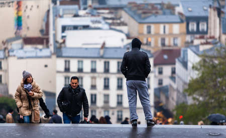 PARIS, FRANCE - NOVEMBER 29, 2013: Tourists in Montmartre. Monmartre area is popular among tourists in Paris, the most visited city worldwide.のeditorial素材