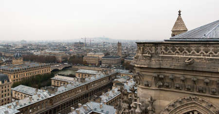 PARIS, FRANCE - NOVEMBER 29, 2013: Gargoyle of the Cathedral of Notre Dame de Paris overlooking Paris, Franceのeditorial素材
